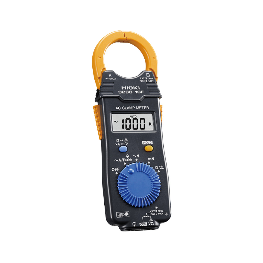 Technician using a clamp meter for electrical current measurement