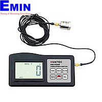Technician handling vibration measurement and balancing instruments for repair service